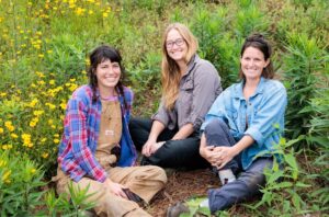 Caitlin Robbins, center, with Swamp Fly partners Ashlee Bracken (l) and Emily Pontiff (r)